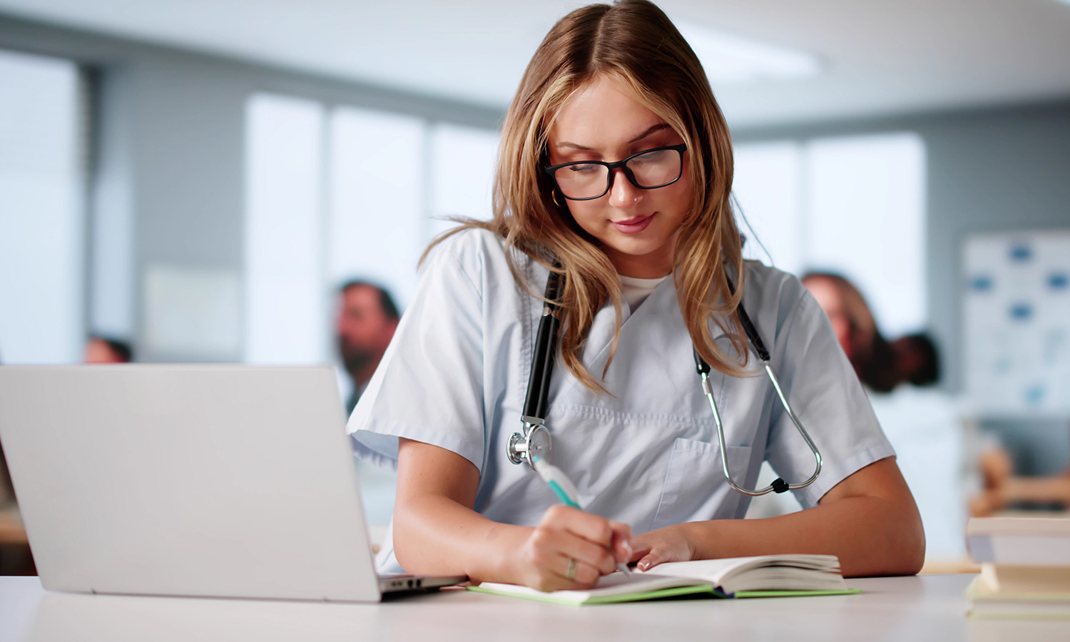 nurse studying at computer