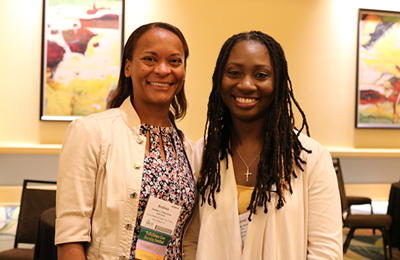 Two smiling nurses at a recent AAACN conference.